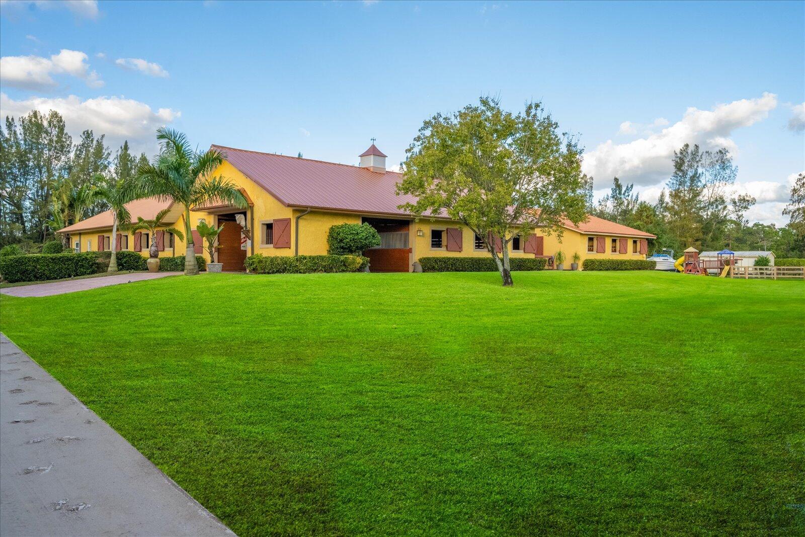 10 dry stalls available in the gated, natural community of Homeland. This lovely barn sits on 5 acres with trails accessible behind the 115 x 200 ft. sand ring with auto irrigation. Stalls are 12 x 12 in the main barn that includes a feed, tack, and restroom. Property features five oversized grass paddocks, jumps, and newly improved wash racks. You will find this location very peaceful and serene, surrounded by lush Florida landscaping. Just 4.5 mi. from the south entrance to Wellington International Showgrounds. Available annually, or a 2 month minimum seasonal lease.