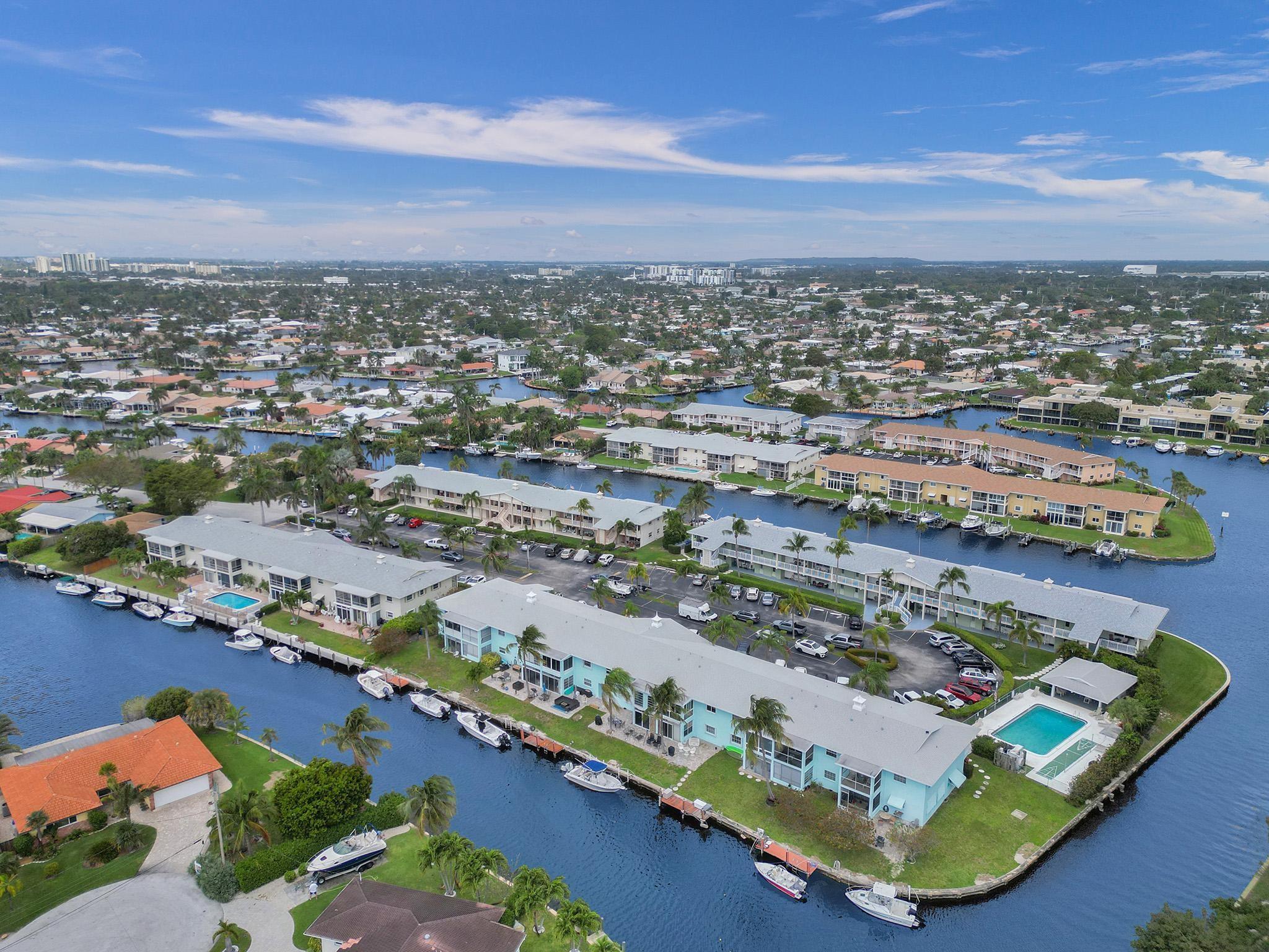 This beautifully upgraded first-floor Cypress Island 2/2 offers the best of waterfront living—just one fixed bridge from the Intracoastal and minutes to the Hillsboro Inlet. The renovated kitchen flows seamlessly into spacious living and dining areas, perfect for entertaining. Enjoy your private screened-in patio, an ideal retreat for peace and privacy.
Take in panoramic water views, enjoy days on the water, and experience the perfect balance of comfort and convenience. Community amenities include a pool, shuffleboard, and BBQ area, along with low dock fees for boaters. Nestled at the quiet northeast end of 9th Ave yet close to shopping, dining, Pompano Beach, and more.