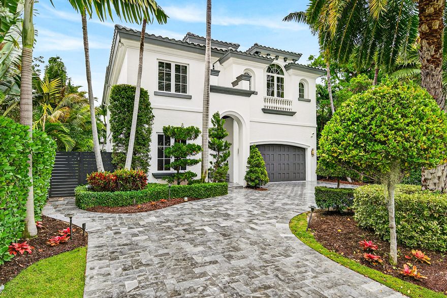 Nestled in the highly sought-after seaside enclave of Por La Mar, this beautifully reimagined Mediterranean villa offers the perfect blend of timeless architecture and modern luxury—just one block from private beach access and ideally positioned on the north end of Lake Boca Raton.  Completely remodeled in 2021, the home showcases a thoughtfully curated interior with elevated finishes throughout. The designer kitchen—worthy of Architectural Digest—anchors the main living space, seamlessly blending style and functionality while overlooking the lushly landscaped backyard, creating an ideal setting for both everyday living and entertaining.  The well-designed floor plan features a spacious ground-floor bedroom suite complete with a walk-in closet and private ensuite bath, ideal for guests  or multigenerational living. Upstairs, four additional guest suites each offer their own ensuite bathrooms, providing comfort and privacy for family and visitors alike.  Additional highlights include natural gas service, a whole-home generator, and refined indoor-outdoor living spaces that capture the essence of coastal South Florida living.  Located just moments from Mizner Park, The Boca Raton, and an array of premier dining, shopping, and lifestyle amenities—all within walking or biking distance—this exceptional residence offers an unparalleled opportunity to experience the best of Boca Raton.