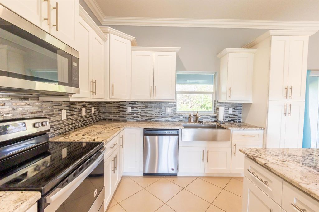 Photo of 2033 SW Susset Lane, Port St Lucie, FL 34953 (MLS # R10900109)