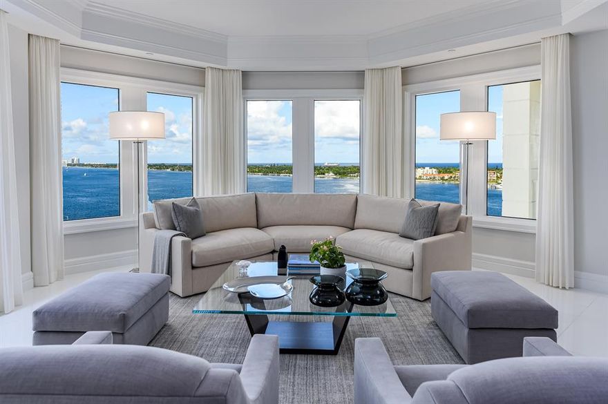 Gorgeously remodeled 4BR/4.1BA condominium with library and rare poolside cabana. This condo features exceptional clean lines and generous living spaces with over 5,800 +/- total square feet.  Commanding views of the Atlantic Ocean and the Intracoastal from this pristine corner unit at the sought-after One Watermark. Featuring Jack Fhilips Design, no detail has been overlooked when creating this clean and well-proportioned space – highlights include gorgeous white glass porcelain flooring, Lutron system, custom plantation shutters, impact windows and doors, and double electric fireplace. Elevator opens to elegant private entry foyer. Gourmet chef's kitchen features custom wood cabinetry, sophisticated white Italian Laminam countertops from Opus Stone top-of-the-line appliances, and butler's pantry with wine cooler leading to formal dining room. Elaborate owner's wing features den, dual walk-in closets, and large master bath. Fantastic indoor-outdoor living with four patios. With a recent significant renovation, the highly desirable One Watermark building offers world-class amenities, including gym, massage room, saunas, valet, dog run, spa, pool, and landscaping by Mario Nievera. Included with this unit is one of only five available cabanas in the building.