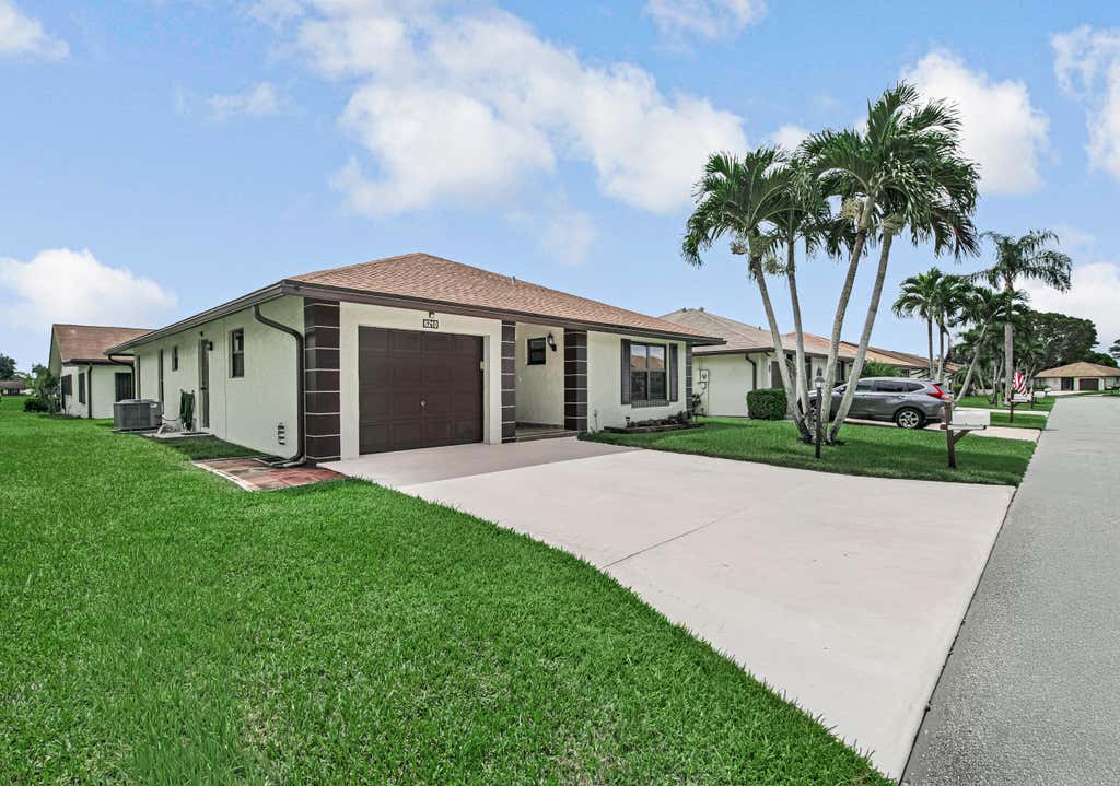 Photo of 6210 Olivewood Circle, Greenacres, FL 33463 (MLS # B26064458)