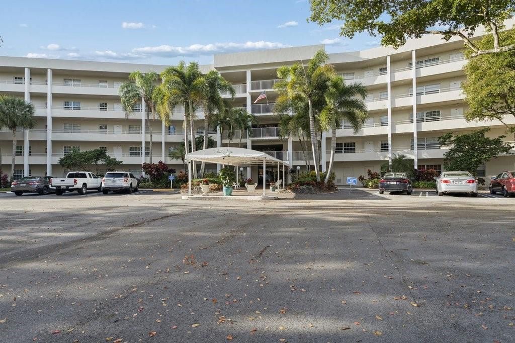 Photo of 821 Cypress Boulevard #408, Pompano Beach, FL 33069 (MLS # F10546585)