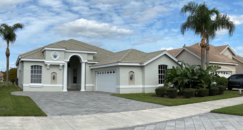 Photo of 676 SW Lake Charles Circle, Port Saint Lucie, FL 34986 (MLS # R10703637)