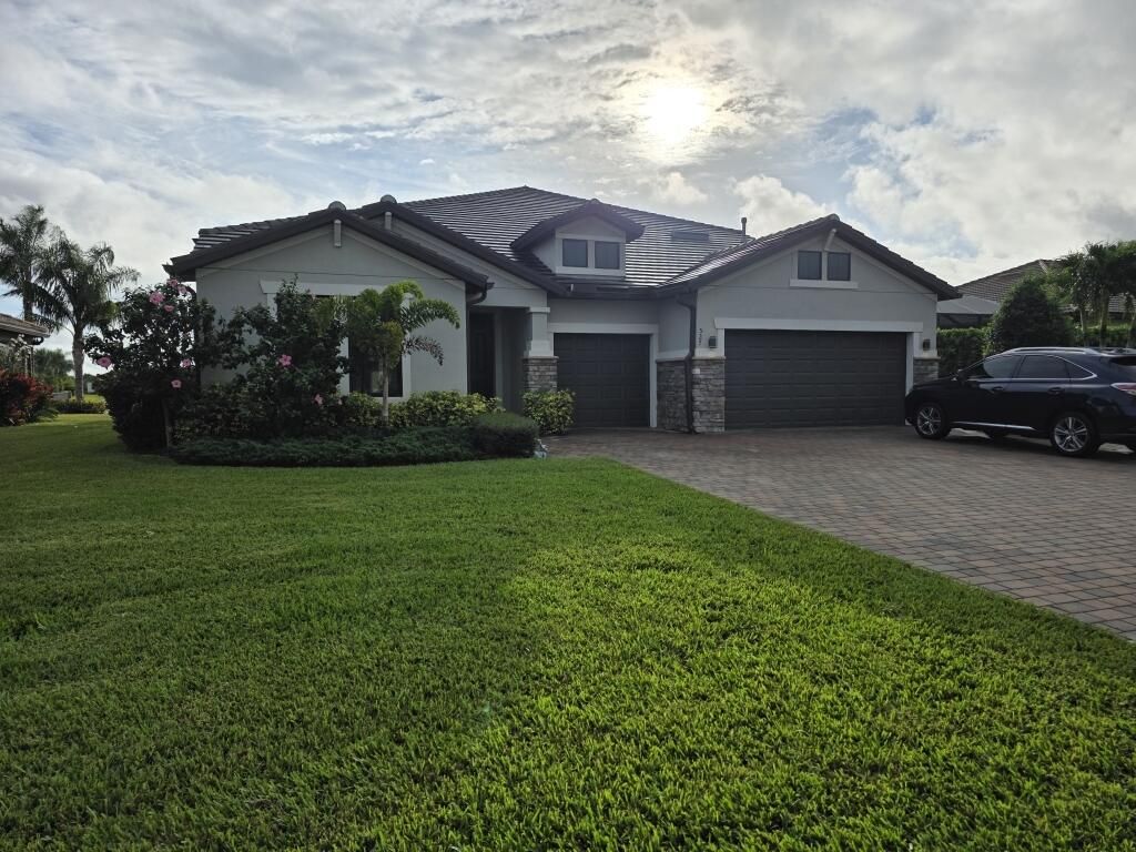 Photo of 527 SE Vallarta Drive, Port Saint Lucie, FL 34984 (MLS # R11149468)