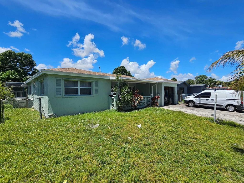 Photo of 3561 NW 33rd Avenue, Lauderdale Lakes, FL 33309 (MLS # B26018249)
