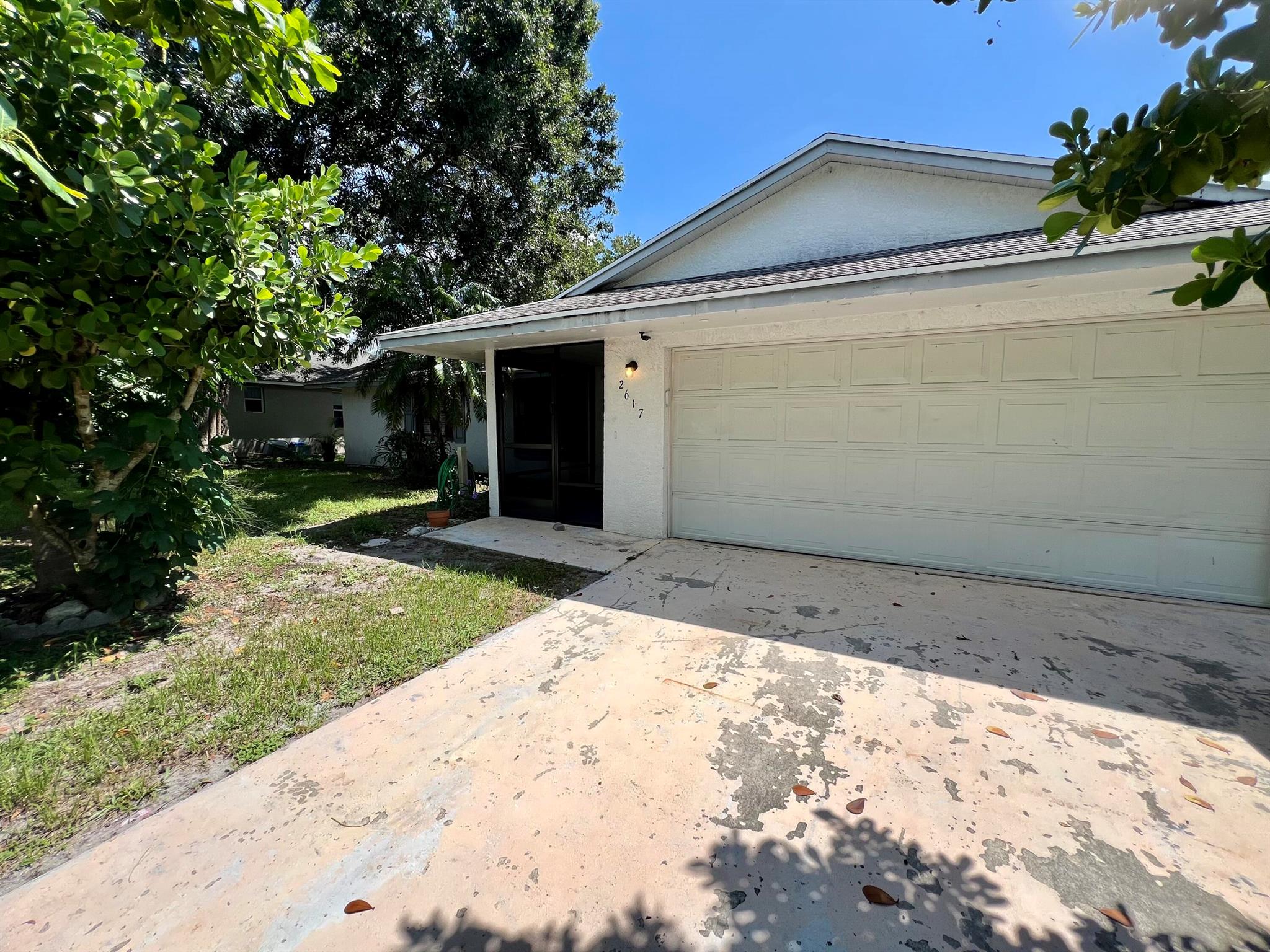Discover this newly remodeled single-family home in Port Saint Lucie! With 3 bedrooms, 2 bathrooms, and a 2-car garage, this residence in a non-HOA community is ready for you to move in. It boasts a fantastic open floor plan, split and stacked bedrooms, and a modern kitchen featuring brand-new stainless steel appliances. For added convenience, there's a washer and dryer hookup.Situated on a canal, this property is ideal for boating and parking trucks. Enjoy the tranquility and charm of Port Saint Lucie, while still being close to shopping, restaurants, and major roads for easy travel. The spacious great room is perfect for family gatherings and entertaining, and all three bedrooms come with walk-in closets.