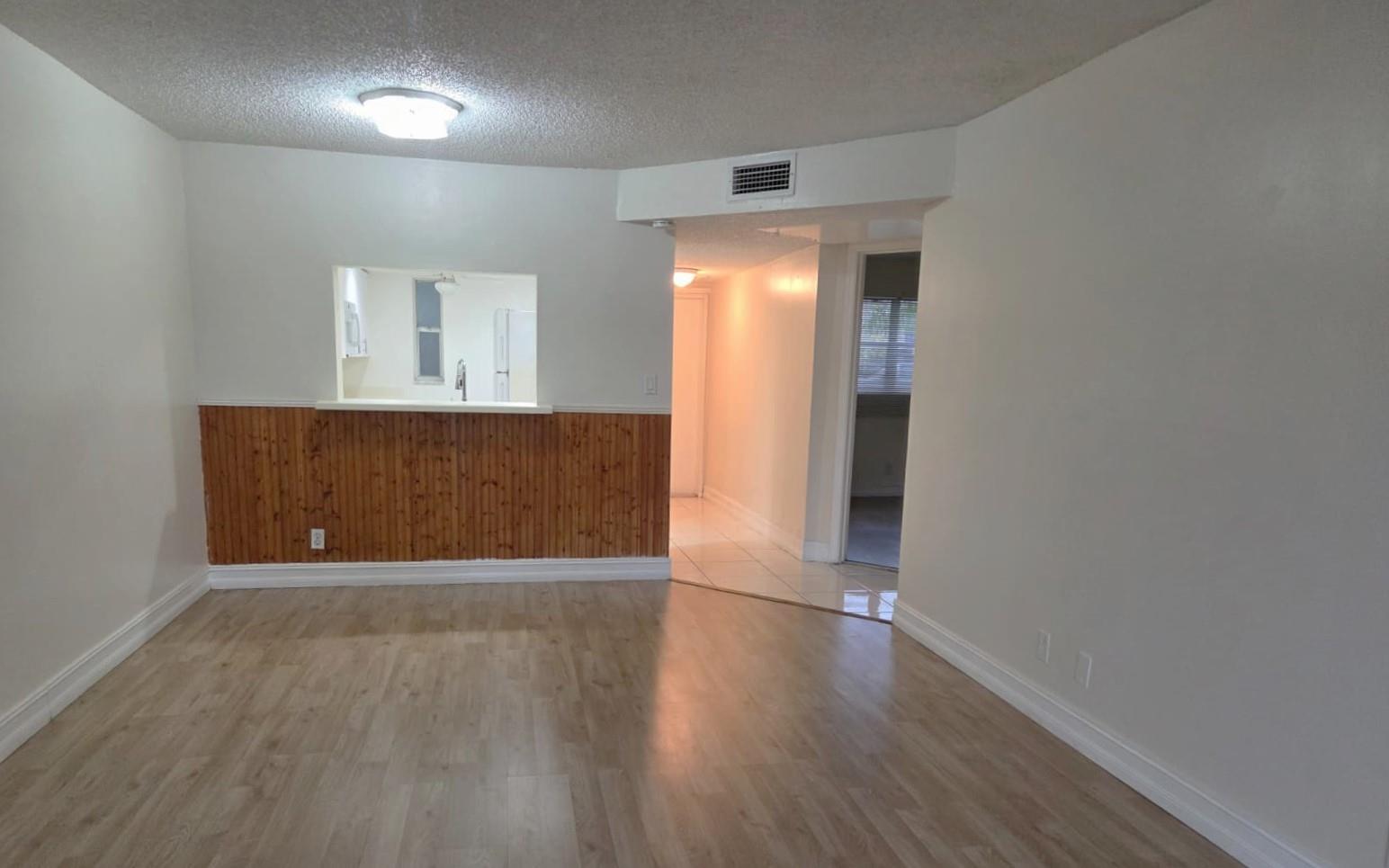 Bright & Spacious Corner Unit with Water Views-Investor Friendly! Beautifully maintained 2/2 first-floor corner unit located in a gated community in the heart of Tamarac. NO carpet. Each unit is allowed a max of 2 registered vehicles (one assigned + guest). Commercial vehicles are permitted but must adhere to the 2-vehicle limit per unit. Semi-trucks/any trucks that cannot fit within the designated commercial parking spaces will not be allowed. Low Maintenance. No rental restrictions after purchase (subject to association approval). Assoc requires 645+ credit score. Swimming pool, tennis courts, clubhouse, common laundry facilities. Washer inside unit. Seller is Foreign National requiring Buyer to sign an Affidavit for FIRPTA withholding Exemption.