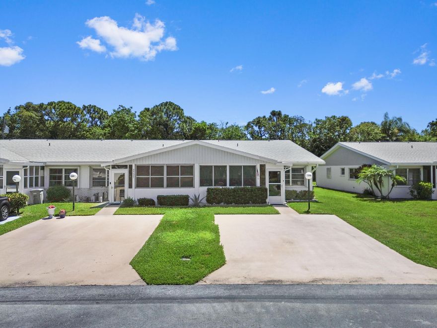 Cypress Lakes is a gated 55+ community featuring a well-maintained home with accordion shutters on all windows. This residence offers 2 bedrooms and 2 bathrooms with 1,250 square feet of living space, including a combined living and dining area. The kitchen comes equipped with appliances and includes a convenient laundry closet with a washer and dryer. Wood flooring runs throughout, and a screened front patio provides a comfortable outdoor space.  Residents enjoy a wide range of amenities, including a pool and hot tub, tennis courts, miniature golf, shuffleboard, pickleball courts, exercise rooms with a sauna, and a library and clubhouse.