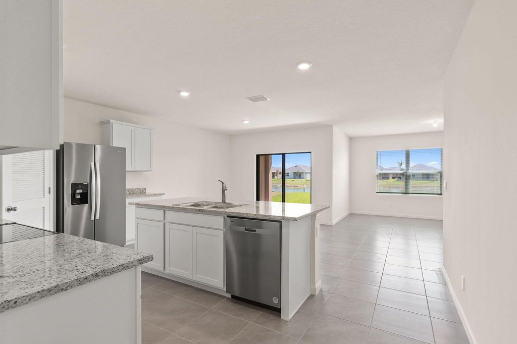 Photo of 9809 SW Triton Way, Port Saint Lucie, FL 34987 (MLS # R10981573)