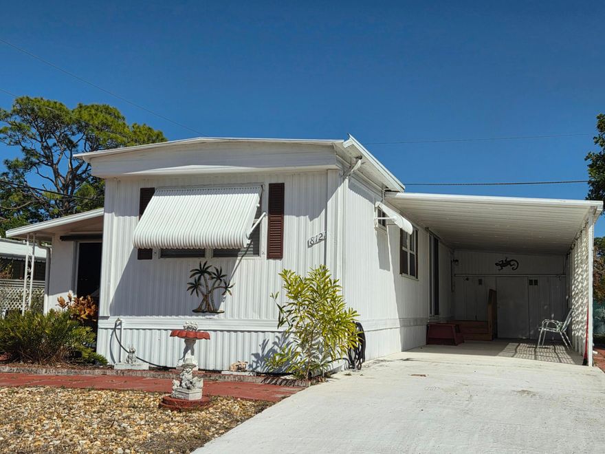 VERY Affordable 2 bedroom 1.5 bath single wide in Ridgeway. Offered turnkey & you own the land. No HOA!  Spacious living includes a full size eat in kitchen with all wood cabinets & stainless sink, a large air conditioned Florida room that can be used as a formal dining room, 2nd living room, office or easily converted into a 3rd bedroom. Large master bedroom adjacent to full size bath with ceramic tile back splash, ample storage thoughout, & a large carport with an enclosed utility room.  Brand new toilets, newer vanity & vinyl flooring, all walls insulated & sheet rocked, metal roof over with additional insulation throughout, all doors replaced w/6 panel doors and FL room has all newer windows & slider. Publix within walking distance & beaches minutes away. Pet friendly & fast closing