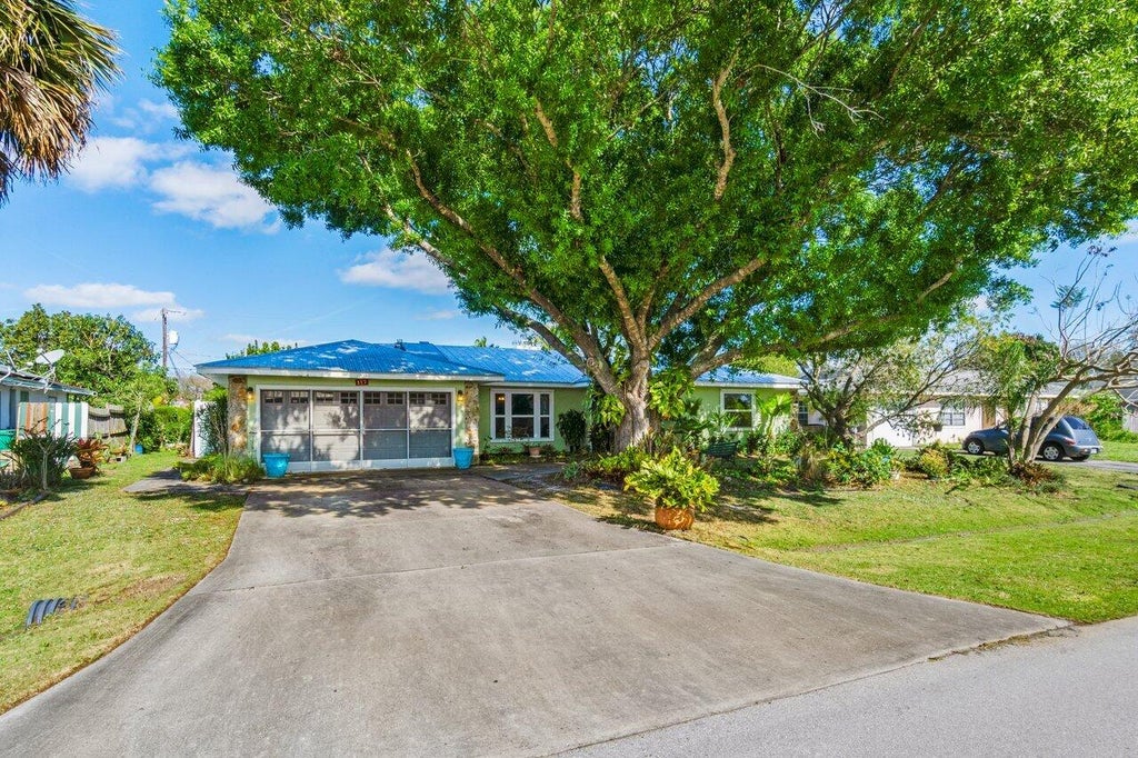 Photo of 117 NE Surfside Avenue, Port Saint Lucie, FL 34983 (MLS # R11065895)