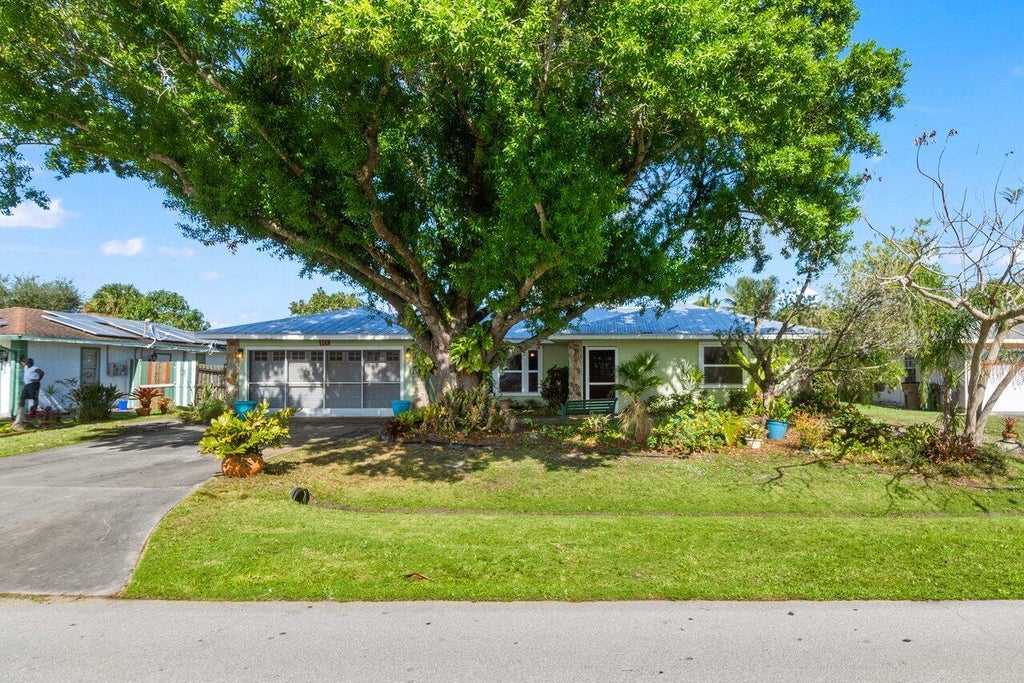 Photo of 117 NE Surfside Avenue, Port Saint Lucie, FL 34983 (MLS # R11065895)