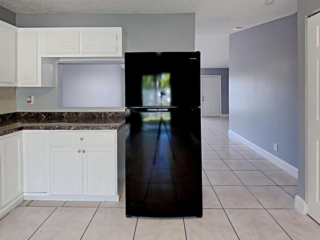 Photo of 5863 Triphammer Road, Lake Worth, FL 33463 (MLS # B26022417)