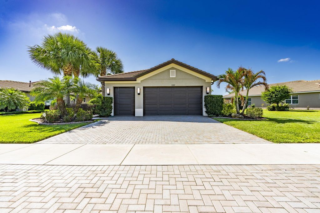 Photo of 11402 SW Half Moon Lake Lane, Port Saint Lucie, FL 34987 (MLS # B26019099)
