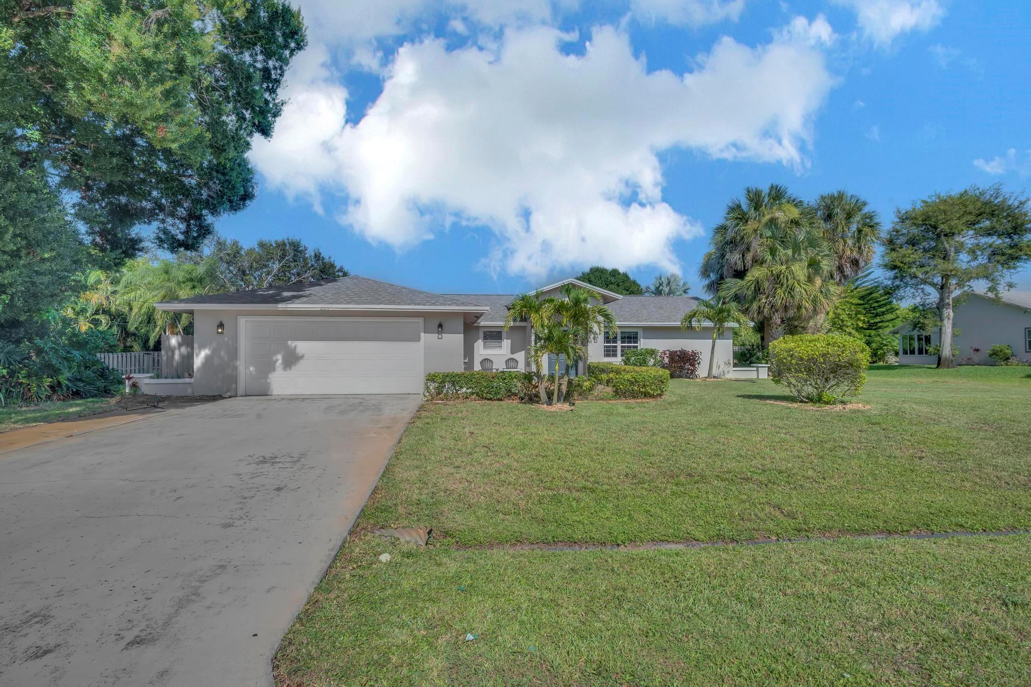 Spacious 4 bed, 3 bath, 2400 sf, pool home on a generous 0.48-acre lot in the heart of Port St. Lucie! This stunning residences boasts a newer roof, elegant granite counters, and beautiful cabinetry throughout. Enjoy the private oasis of your sparking pool, surrounded by lush landscaping, ideal for outdoor fun and tranquil evenings. This home is a perfect blend of luxury and comfort in a PRIME LOCATION. Don't miss this Port St. Lucie gem!