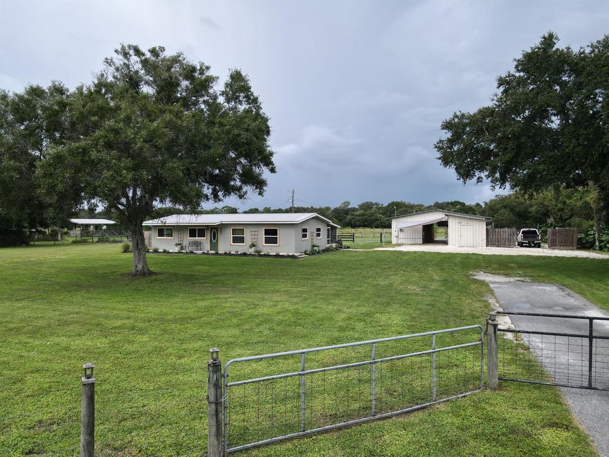 EASTERN OKEECHOBEE COUNTY! 3 bed 2 bath home on 4 acres. Perfect for commuting to Palm Beach, Saint Lucie or Martin county. This property offers 4 acres of agricultural zoned land, perfect for your mini farm. It's fenced and cross fenced with good grass and a pond. Also, there's plenty of native wildlife to be seen from the ranch next door. The large barn has power and water, room for multiple stalls, has a tack room, work shop area and a meat processing room with a walk-in cooler. There's also a chicken condo and raised garden beds for your self reliant food source. The home offers many upgrades such as a metal roof, impact windows, new doors, new paint, new flooring and butcher block countertops. Enjoy the evenings on the back screened porch or take a dip in the 18x33ft above ground