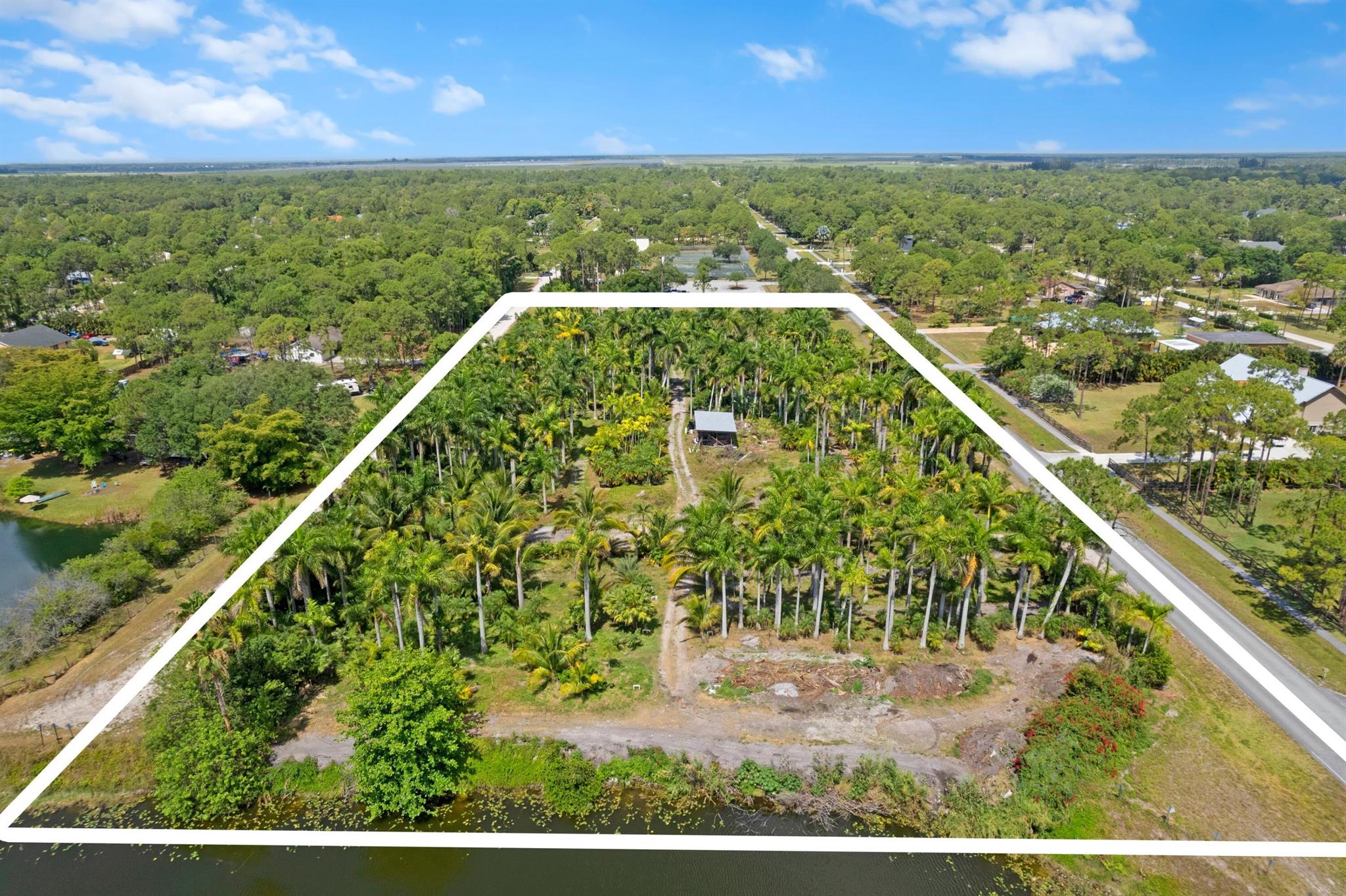 LOCATION, LOCATION, LOCATION!!!! 5. 11 ACRES UNIQUE AND RARE OPPORTUNTY. There are two (2) parcels 3.51 acres and 1.60 acres. Perfect location for for multi living or an Estate home with Detached Garage, Guest House, Stables, Arena, Barn the possibilities are limitless!!!! This is a Designated Equestrian Area. Currently, there is an existing building pad for up to a 10,000 square ft house, de excavated drain field. Also, a full irrigation system.The setting of the property is IDEAL. Road access on both Templ and 79th, Templ Park on West side, and extra wide canal on East side of property. Fully fenced and tree lined