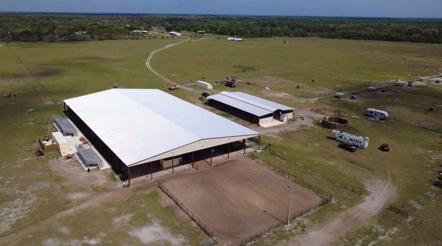 Rare opportunity to own a fully equipped 222.9-acre turnkey rodeo and equestrian facility built for serious operations and large-scale events. This one-of-a-kind property features a covered, lighted 140x250 arena, 6 bucking chutes, and a professional roping chute with box. Entertain and host with ease from the announcer's birdhouse overlooking three sets of bleachers. Designed for performance and capacity, the property includes a 16x32 round pen, 6 fenced pastures, and 16 oversized horse paddocks (approx. 200x100 each). The impressive 18-stall center-aisle barn offers 12x24 stalls, feed room, wash rack, and tack room. Complete with a 12x24 A/C office, full electric, 50-amp service, three septic systems, and five bathrooms. Built for rodeo, training, or income-producing events.