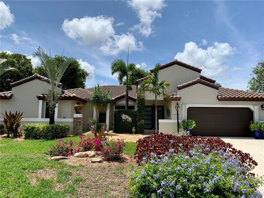 Beautiful and spacious! Gorgeous tile throughout living areas. The gourmet kitchen is a chef's delight complete with granite counters, rich cabinetry and a kitchen island. Stainless steel appliances. Time to make culinary masterpieces! Large family room on one side of the kitchen and entry to the formal dining room on the other. Elegant formal living room. Extra large master bedroom including sitting area with 2 full luxurious master baths each with it's own walk in closet. Three additional spacious bedrooms. 3.5 updated bathrooms in total. Huge resort style fenced backyard complete with a heated sparkling pool including shallow sitting area and a fire pit for cozy get togethers. Covered patio is perfect for entertaining. Impact windows/doors. Two car garage. Interior laundry room with tub