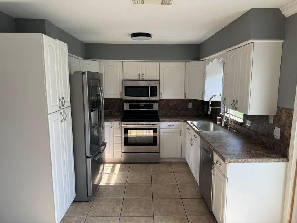 Photo of 2711 S 27th Street, Fort Pierce, FL 34981 (MLS # R11158441)