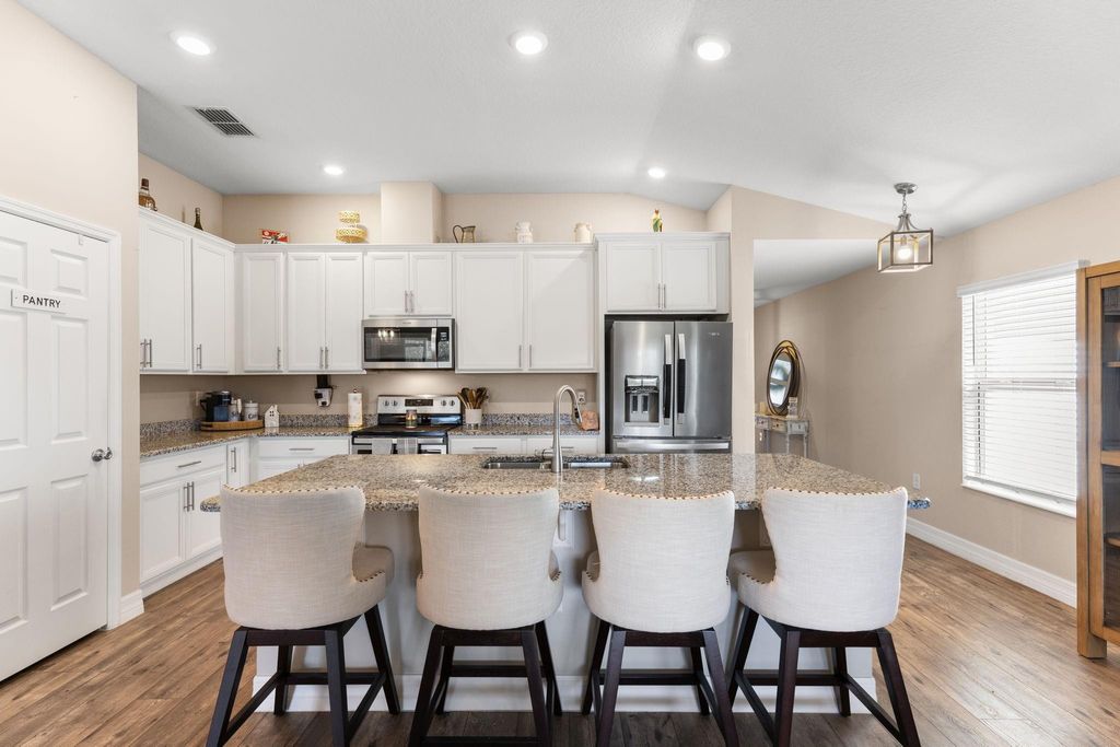 Photo of 5580 NW Pine Trail Circle, Port Saint Lucie, FL 34983 (MLS # B26024066)