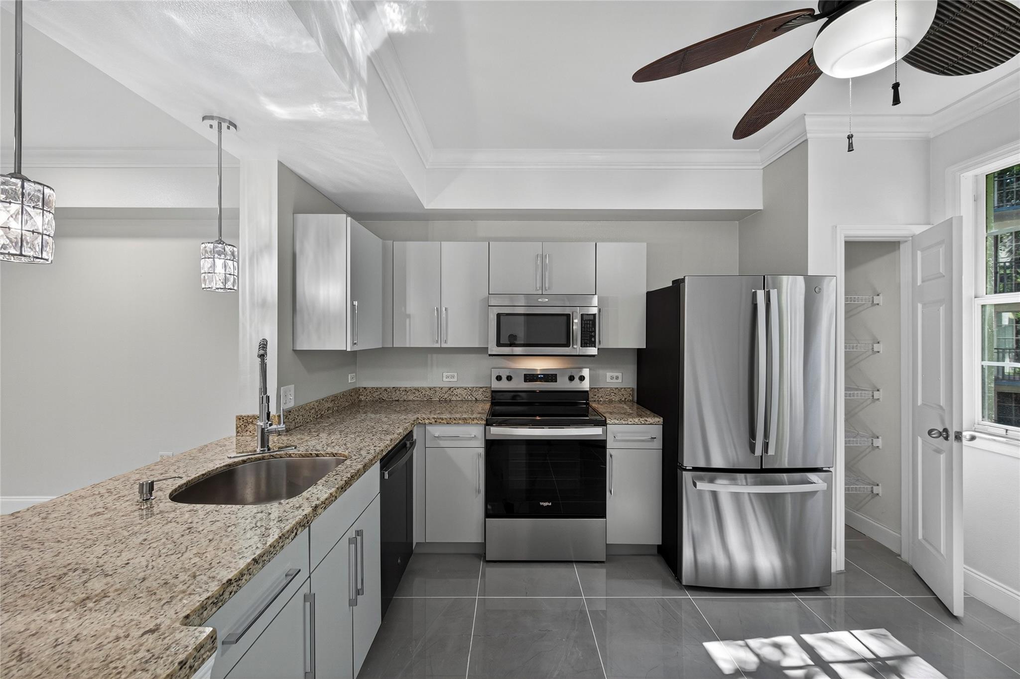 Welcome home to one of the largest one-bedroom plus den floor plans at Sole, a contemporary and sought-after community just steps from vibrant Flagler Village. Enjoy easy access to the area’s best new restaurants, shops, FAT Village art scene, Las Olas, coffee spots, and nightlife! This beautifully upgraded condo features an open-concept kitchen, modern finishes, and thoughtful details throughout. Relax with tranquil views of the lush secret garden and  waterfall. Enjoy the convenience of an in-unit washer and dryer, and an impressive list of amenities, including a fitness center, resort-style pool, conference room, on-site management, security, internet, water, and trash, included in your association fee. Pet-friendly community. Move right in and start living the downtown lifestyle.