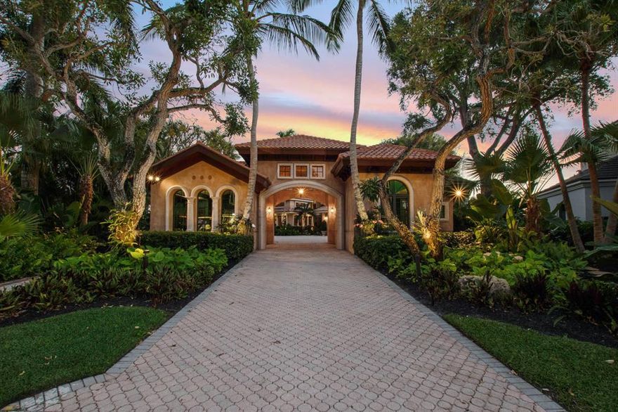 Tucked back on a coveted lot in the prestigious golf community of Frenchman's Creek Beach and Country Club, this magnificent estate offers over 7,000 square feet of luxurious living space with a separate Guest House.  The pinnacle in luxury living, this estate offers over 260 feet of water frontage, a 50' dock with boat lift and 4.5 garages.  Including 2 detached show garages making it a car and boat lovers dream!  Fabulous spaces for entertaining include a grand living room with fireplace, exquisite hand painted formal dining room, custom chef's kitchen and so much more.  At the back of the home find tropical bliss - a gorgeous swimming pool and spa, gazebo covered summer kitchen and dining area, and winding patio with verdant gardens – all looking out to the serene canal beyond.