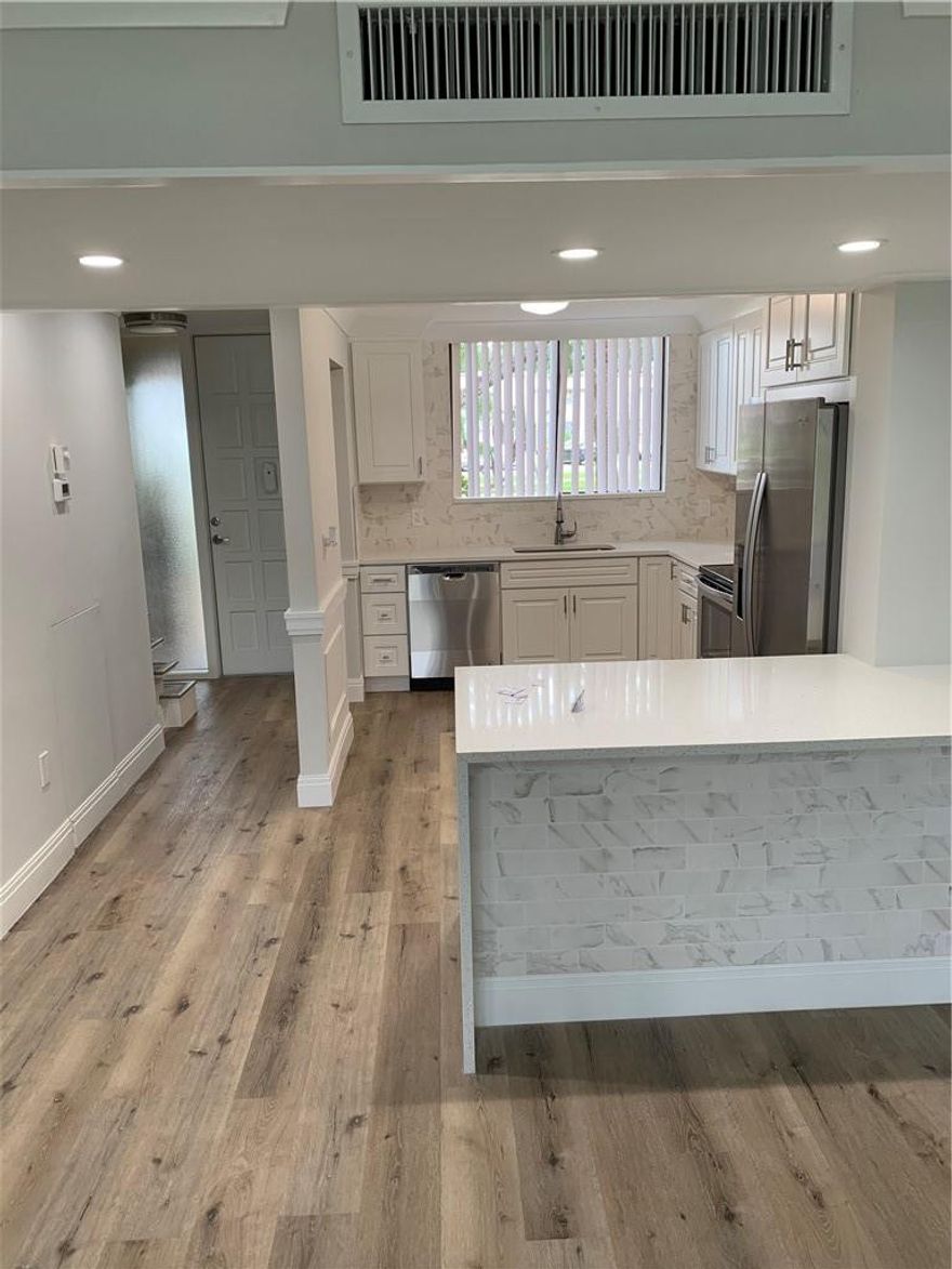 Completely renovated 3/2.5 Town-house with New open concept Kitchen and stainless steel appliances. All Luxury Vinyl 100% waterproof, upgraded baseboards and crown moldings, NEW ELECTRICAL PANEL & A/C and Water Heater. Enjoy your oversized open Florida Rm w. garden views and Community with swimming pool.Two master suites one up & one down. Master downstairs has ''Barn Door, huge walk-in closet & Callacata Counter Tops. All the baths are updated. Experience the peace & ambiance of manned guard gates & 24-hour security patrols Minutes away from Fla. turnpike, I95, great shopping, restaurants, entertainment, hospitals, airports & beach.55+ community