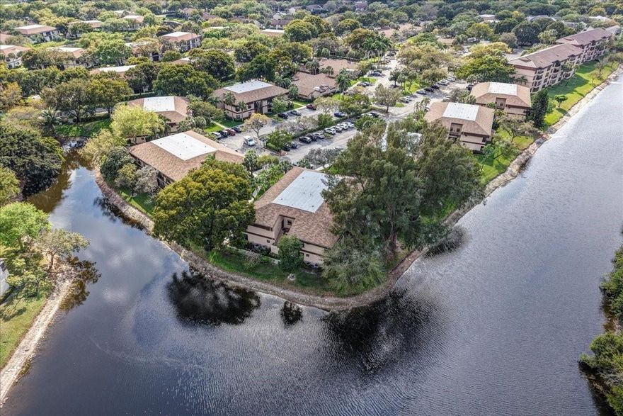 SELLER OFFERING CONCESSIONS TO BUYER. Beautifully remodeled 2-bedroom, 2-bathroom first-floor condo (no stairs!!) in desirable Township. This spacious unit features a modern open floor plan with vinyl flooring, stunning kitchen with quartz countertops, high-end cabinets, and stainless-steel appliances. Both bathrooms are tastefully upgraded. Enjoy the Florida lifestyle on your screened-in porch, with full size laundry closet and storage, overlooking lush garden views and enjoying all amenities the community offers, such as pool, clubroom, walking/jogging paths, aquatic center, theater... Conveniently situated minutes from beaches, shopping centers, and entertainment. Zoned for excellent schools. Don’t miss this opportunity to live in one of Coconut Creek’s most sought-after neighborhoods!