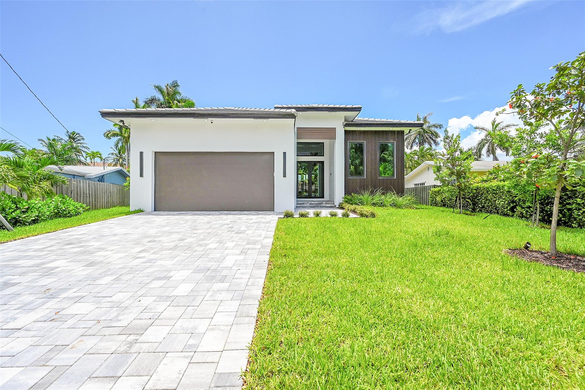 2025 newly-constructed Wilton Manors luxury waterfront residence located on Middle River with a new 85-ft seawall and ocean access, 3 spacious bedrooms and 3 designer bathrooms, blending timeless elegance with expert craftsmanship. This home comes equipped with a chef’s kitchen design with high end appliances, quartz countertops, and an outdoor kitchen. The expansive living area features premium finishes and floor-to-ceiling windows, creating a seamless indoor-outdoor feel. Centrally located near Wilton Manors Drive, this home is walking distance from all things Wilton Manors and a short drive to Downtown Fort Lauderdale/Las Olas, the beach, great shopping and restaurants, and Fort Lauderdale Airport.