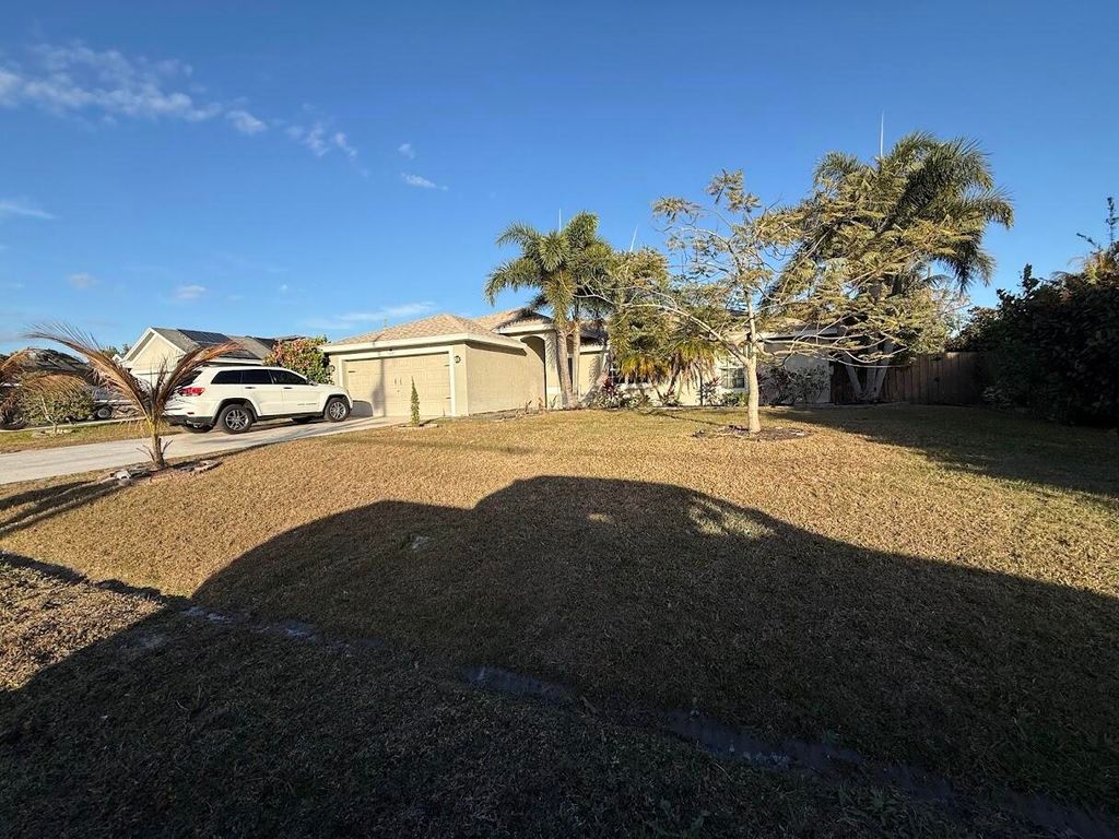 Photo of 3647 SW Ballweg Street, Port Saint Lucie, FL 34953 (MLS # R11160488)
