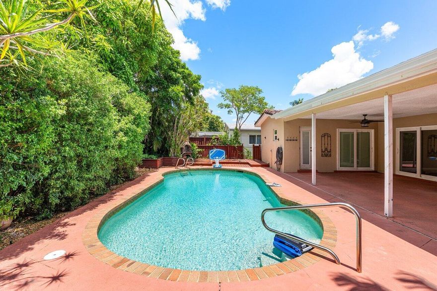 This home offers a serene 3-bedroom, 2-bathroom layout, complete with your own private backyard retreat. Inside, enjoy the peace of mind provided by full impact windows and doors (2019), BRAND NEW AC system (2025), and all-new ductwork (2018), tankless water heater ensures endless hot water on demand, a timeless barrel tile roof (2004), AND EV car charger. .Step into an outdoor paradise featuring a saltwater pool , surrounded by lush, mature landscaping that creates an ambiance of total privacy and tranquility. The expansive pool deck, crafted from marine-grade pressure-treated lumber, seamlessly blends with a covered patio--an ideal setting for entertaining or peaceful relaxation.