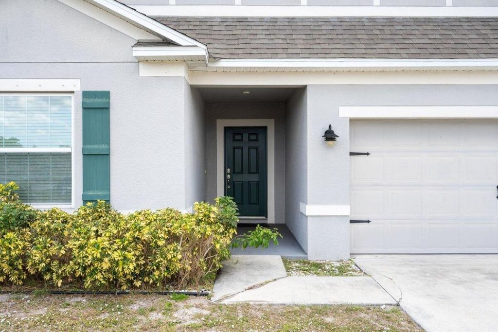 Photo of 3650 SW Rivera Street, Port Saint Lucie, FL 34953 (MLS # R11084094)