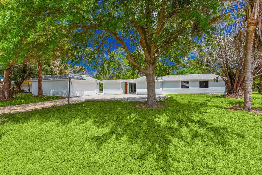 NO HOA in Tropical Farms, Stuart, FL. Wrapped with Hardiplank siding in Tropical Farms Estates. Renovated with new kitchen, bathrooms, every corner says "you've been waiting for this new door." The quiet 3-bedroom, 3-bath home (1,586 sq ft) sits on a spacious ¾-acre (.79 acres). Brand-new feeling meets the deep roots of Tropical Estates. Step inside to a bright, open-plan layout perfect for laughter-filled parties. The re-imagined kitchen flows seamlessly into open family spaces. Out back, blue water calls—enjoy poolside dreams in your private, quiet oasis with huge yard to accommodate a boat, camper, or future adventures. Detached 2-car garage & a 2021 roof complete the picture. Smell the cookout, hear the kids out at play. Create your family stories at 8587 18th Avenue, near Phipps Park! NO HOA in Stuart, Florida in Tropical Farms. Wrapped with Hardiplank siding in Tropical Farms Estates. Renovated with new kitchen, bathrooms, every corner says "you've been waiting for this new door." The quiet 3-bedroom, 3-bath home (1,586 sq ft) sits on a spacious ¾-acre (.79 acres). Brand-new feeling meets the deep roots of Tropical Estates. Step inside to a bright, open-plan layout perfect for laughter-filled parties. The re-imagined kitchen flows seamlessly into open family spaces. Out back, blue water calls—enjoy poolside dreams in your private, quiet oasis with huge yard to accommodate a boat, camper, or future adventures. Detached 2-car garage & a 2021 roof complete the picture. Smell the cookout, hear the kids out at play. Create memorable family stories at 8587 18th Avenue, near Phipps Park where you can launch your boat at the Locks. Enjoy easy access to Stuart's water ways lifestyle. Bring the boat, the camper, workshop, toys—anything goes!