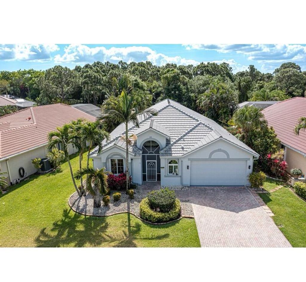 Photo of 577 SW Lake Charles Circle, Port Saint Lucie, FL 34986 (MLS # R10981660)