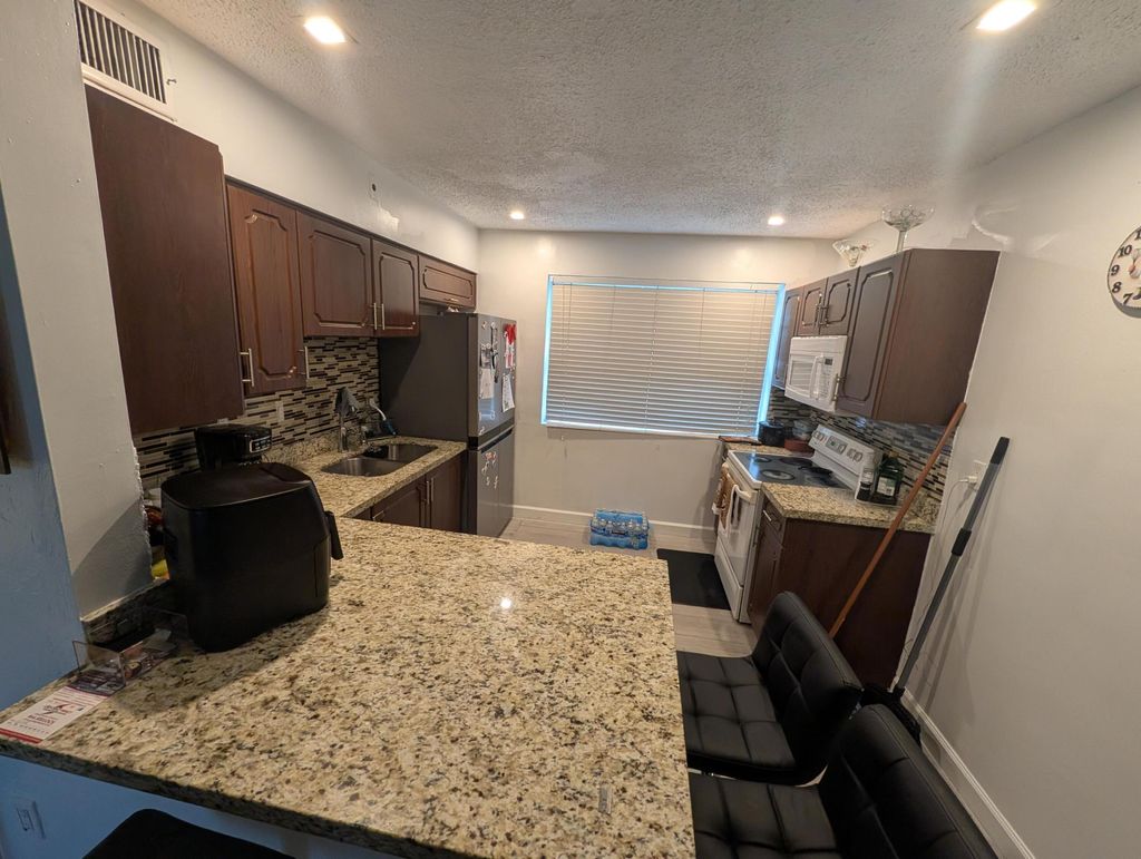 Photo of 6104 SW 20th Street, Miramar, FL 33023 (MLS # B26005666)