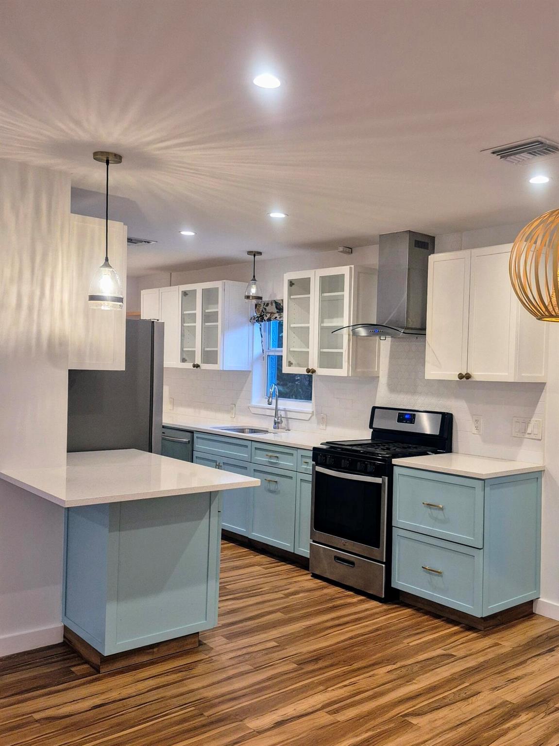 This stunning, move-in-ready home perfectly blends modern luxury with coastal charm. 225 Park Ave, is a beautifully renovated 3-bedroom, 2-bath residence featuring a custom designer kitchen, spa-inspired luxury bathrooms, signature closets and fully upgraded electrical and plumbing (2017). A new metal roof (2023). Hurricane impact windows, doors and new stucco provide peace of mind and exceptional curb appeal. Situated on Park Ave, the vibrant Main Street of Lake Park, this property offers a spacious circular driveway and an oversized lot with room for a guest house, boat or RV. Just minutes to the Intracoastal Waterway, parks, dining, shopping, and entertainment, this home is a rare find for buyers seeking turnkey convenience, prime location, and strong future value.