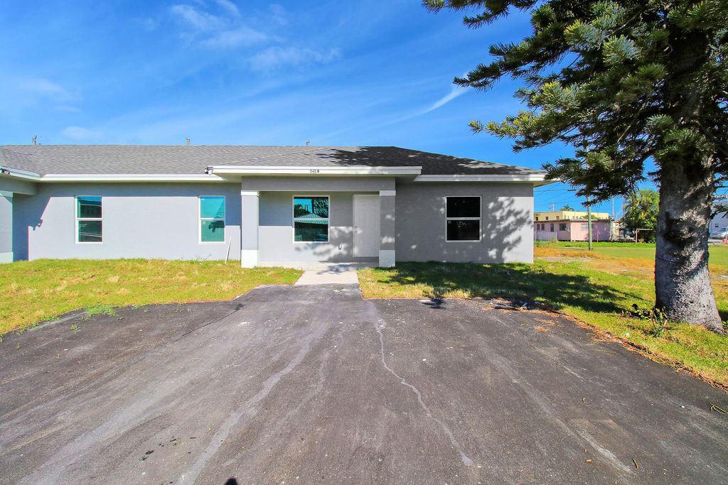 Photo of 548 SW 5th Street #B, Belle Glade, FL 33430 (MLS # R10976887)