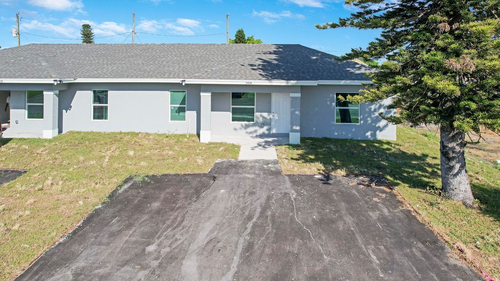 Photo of 548 SW 5th Street #B, Belle Glade, FL 33430 (MLS # R10976887)