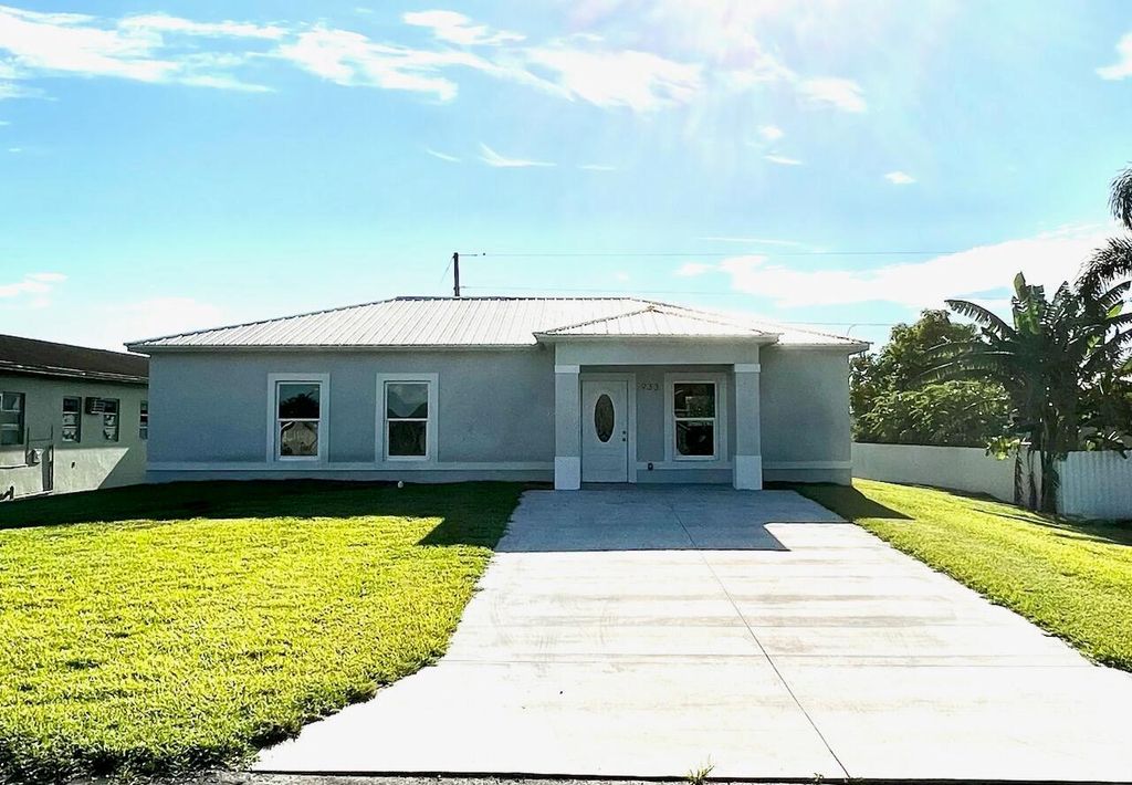 Photo of 933 NW 1st Street, Belle Glade, FL 33430 (MLS # R10919315)