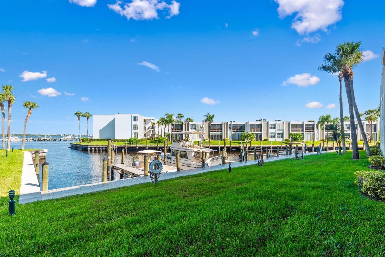 Calling all boaters and lovers of water! Enjoy wide water views and dockage at just $1.50/ft per month for vessels up to 36ft--no fixed bridges! Located in a 55+ community, this 2 bed, 2 bath unit features a remodeled walk-in shower in the primary suite, washer/dryer in-unit, new A/C (2025), and a 1-year-old water heater. Recent upgrades include 2-year-old seawalls, piers, dock walkways, fresh exterior paint, and a new roof being installed. No special assessments pending. Your blank canvas awaits--bring your vision and enjoy the waterfront lifestyle!