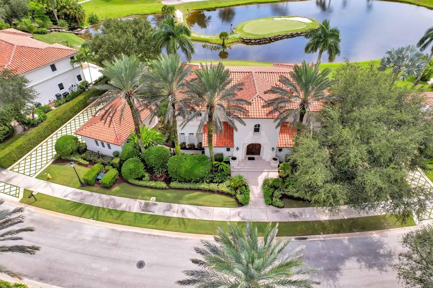 HOME PURCHASE INCLUDES CLUB AND GOLF MEDALLION MEMBERSHIP. This elegant stately home is over 5,200 square feet under air and centers around a two-story great room with a balcony on the second floor with panoramic views of Old Palm. The floor plan includes four spacious primary bedroom suites overlooking the Lake, golf course, 19th hole, and the newly renovated and expanded Old Palm Club House. This is a rare opportunity to enjoy all the world-class amenities that Old Palm has to offer without purchasing an Equity membership. Through the Medallion membership program, offered only to the owners of the Golf Cottages, a minimum of two memberships and up to four memberships are available simply by paying annual dues. Club membership provides the opportunity to play on this pristine signature