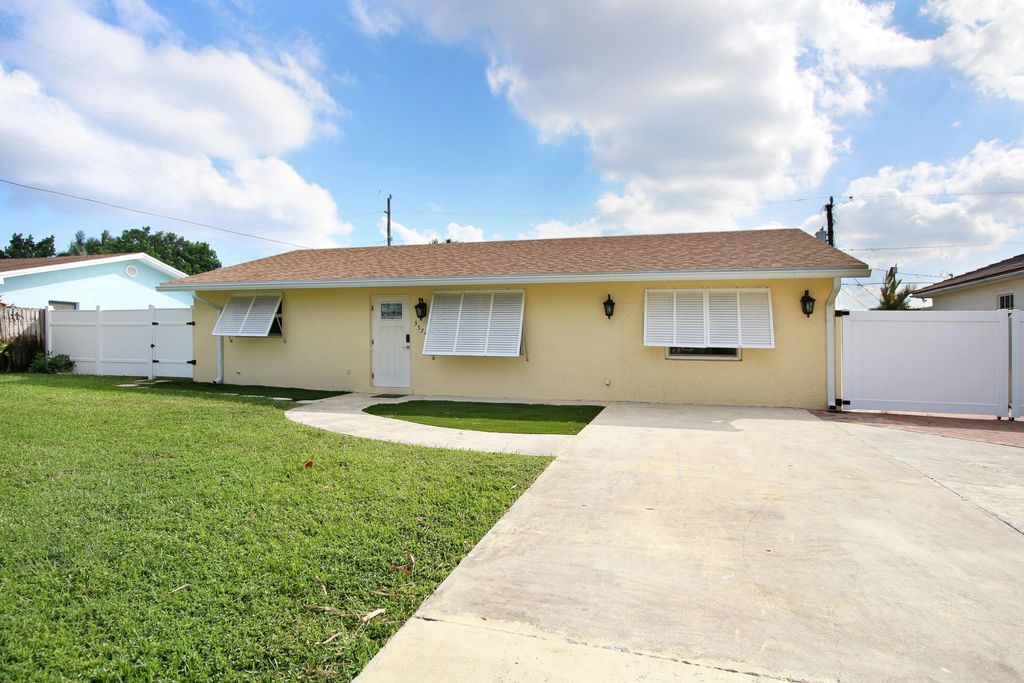 Photo of 3574 Vagabond Road, Lake Worth, FL 33462 (MLS # R11047992)