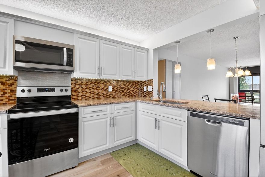 Spacious 2nd-floor, 2-bedroom, 2-bath condo located in Indian Spring Country Club. Enjoy stunning nightly sunsets and a fabulous golf course views from your enclosed patio. The updated kitchen features new flooring and stainless steel appliances, and the home offers valuable upgrades including a new AC unit installed in 2022, a new washer and dryer added in 2024, and a new microwave and oven installed in 2022. Located near the satellite pool, the condo provides comfort, convenience, and a serene setting. The community offers a 24-hour manned gate, and golf and social memberships are available but not mandatory. The unit is also being sold partially furnished,