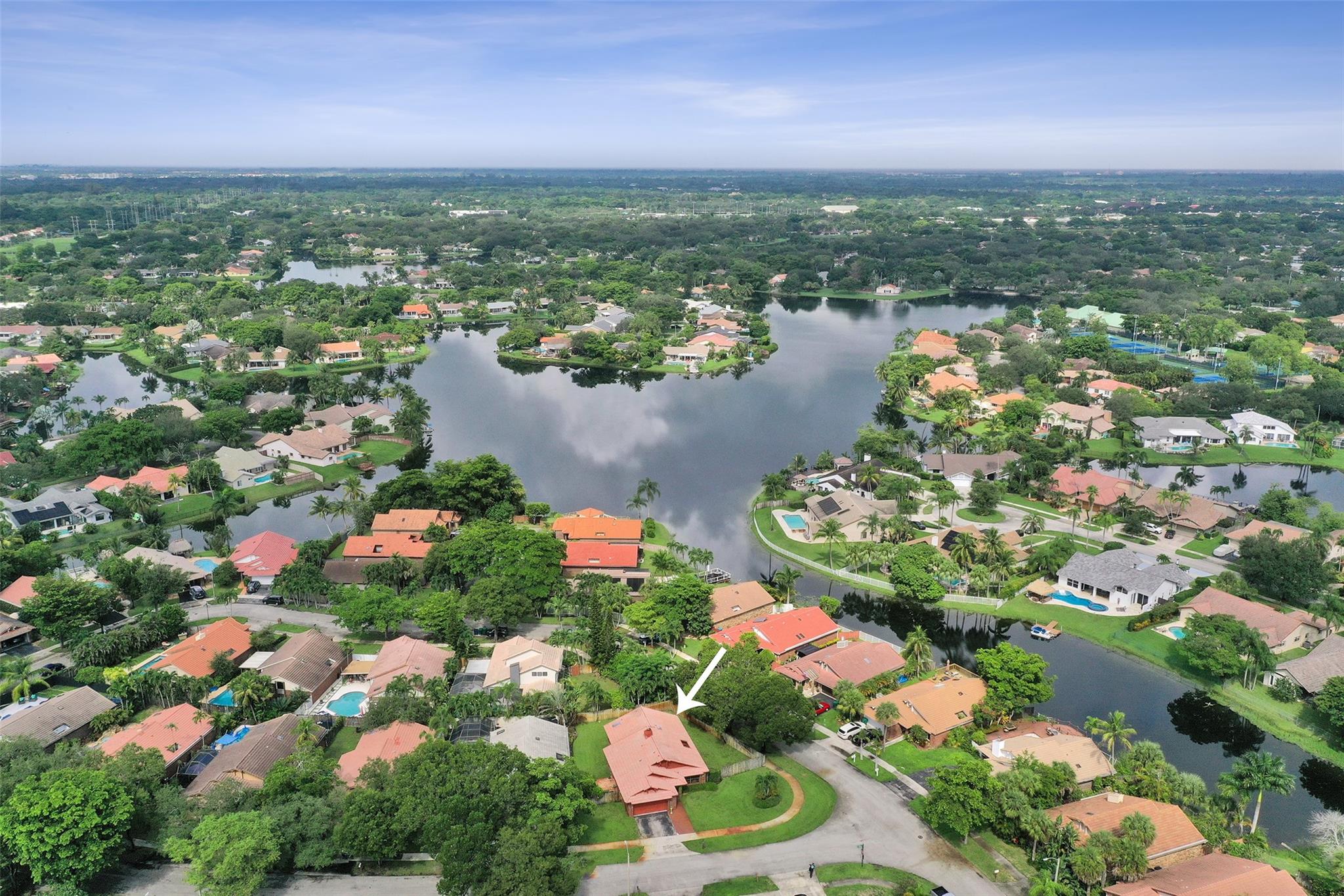 Great Rock Creek neighborhood in sought after Cooper City school district. Prime corner lot, one of the largest in the community with room for a pool. Well-maintained original owner home full of warmth & character. This 3/2 boasts a double door entry, great vaulted ceilings, open living & dining room with landscaped atrium, kitchen with double oven, granite counters, wood cabinets & stainless appliances (Ref 2024, DW 2025), large eat-in kitchen/family room with cozy working wood-burning fireplace, spacious master bedroom with ensuite bathroom & access to the fully fenced yard, & 2-car garage. Low Rock Creek HOA - $200/qtr & Quaypoint $125/yr, just $77/month total! Discounted resident rate for the Cooper City Pool and Tennis Center with fitness facility and various classes.