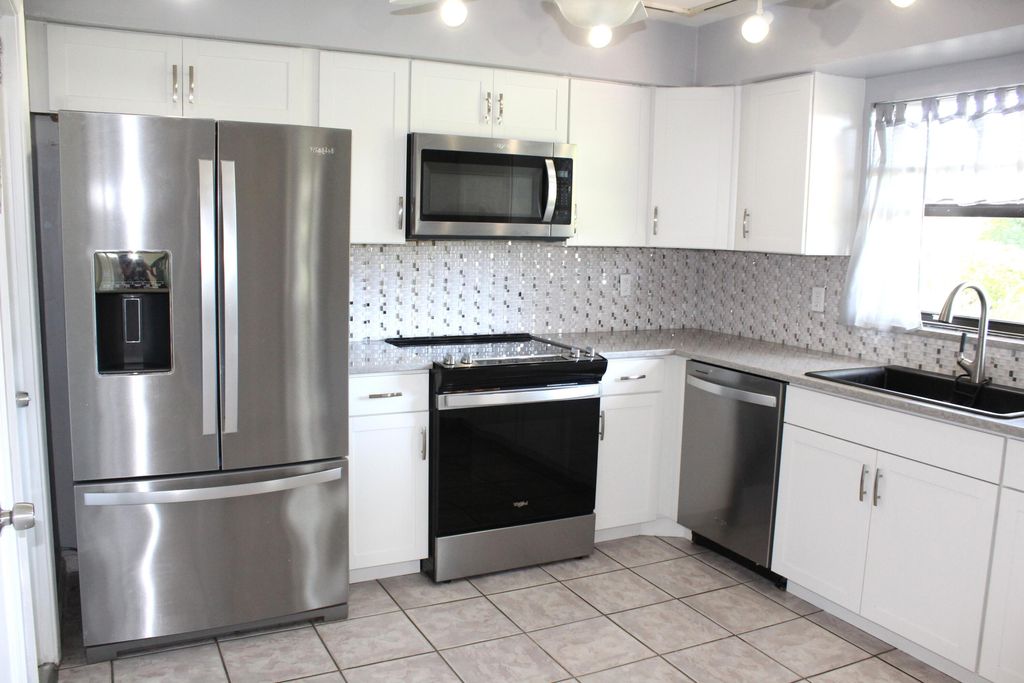 Photo of 9945 Papaya Tree Trail #B, Boynton Beach, FL 33436 (MLS # B26008328)