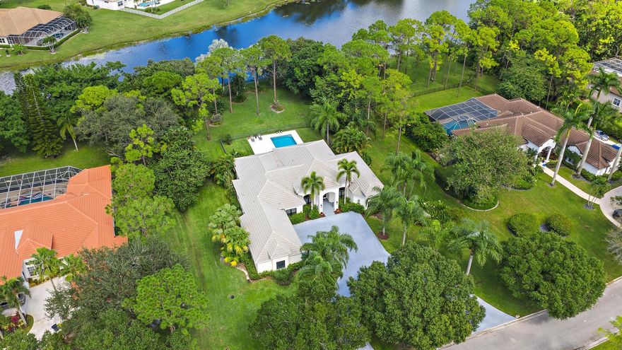 Set on one of the largest and most private lots in Bay Hill Estates--an extraordinary 290 feet by 170 feet--this stunning single-story home at 11771 Stonehaven Way offers an unparalleled blend of space, privacy, and contemporary comfort. Surrounded by lush landscaping and tranquil lake views, this 3,242-square-foot residence is a rare opportunity to own one of the community's most impressive properties. A sweeping circular driveway and three-car garage create a grand sense of arrival, while inside, soaring ceilings and walls of glass fill the home with natural light. The thoughtful split floor plan includes four spacious bedrooms, a den/office, three full baths, and two half baths--offering the perfect balance of openness and privacy.