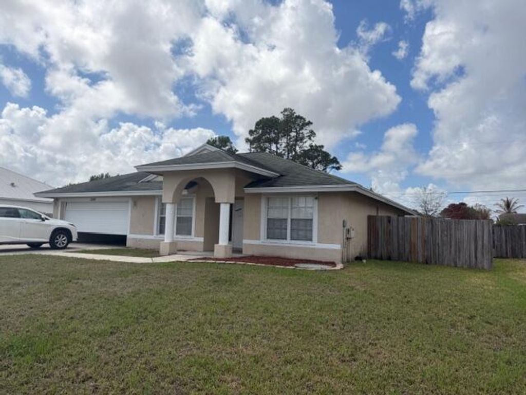 Photo of 1200 SE Ladner Street, Port Saint Lucie, FL 34983 (MLS # B26000176)