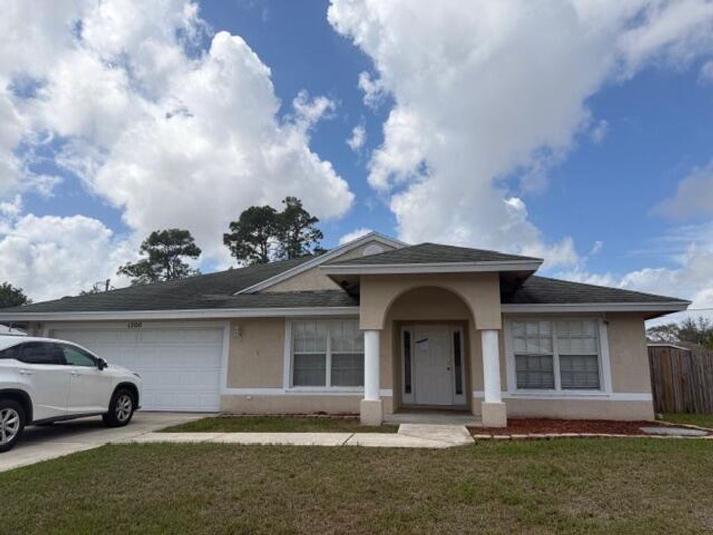 Photo of 1200 SE Ladner Street, Port Saint Lucie, FL 34983 (MLS # B26000176)